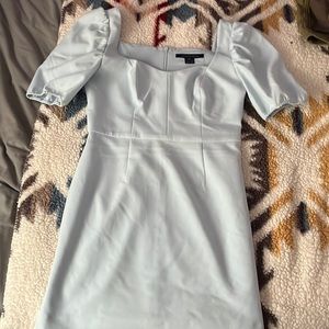 A baby blue dress, stops right at the knee. The size is medium